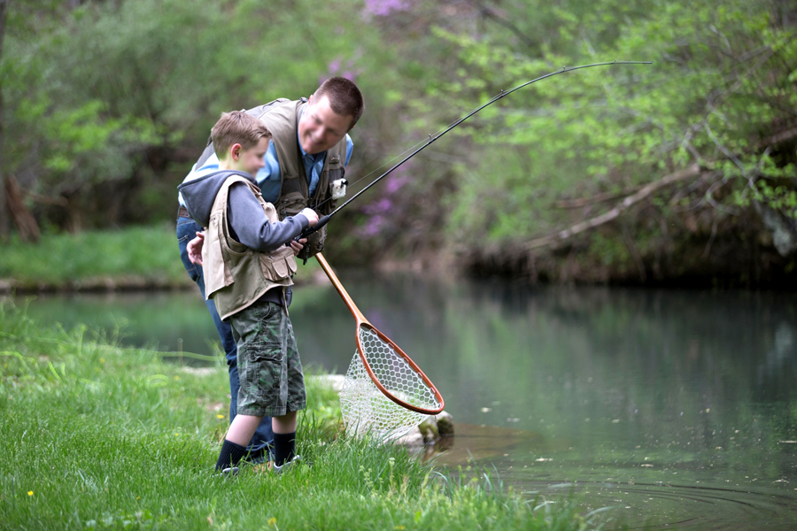 Big Cedar Lodge Father and son fishing for lunker trout in Dogwood Canyon